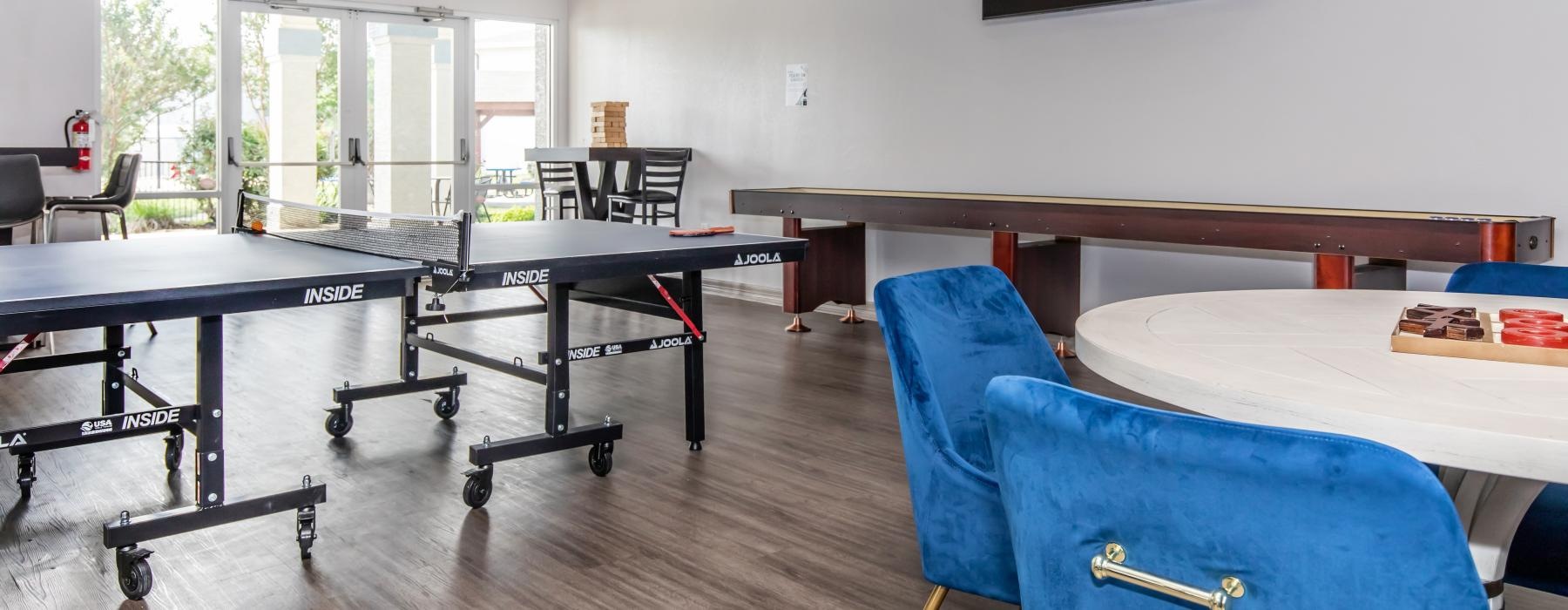 game room with tables and chairs