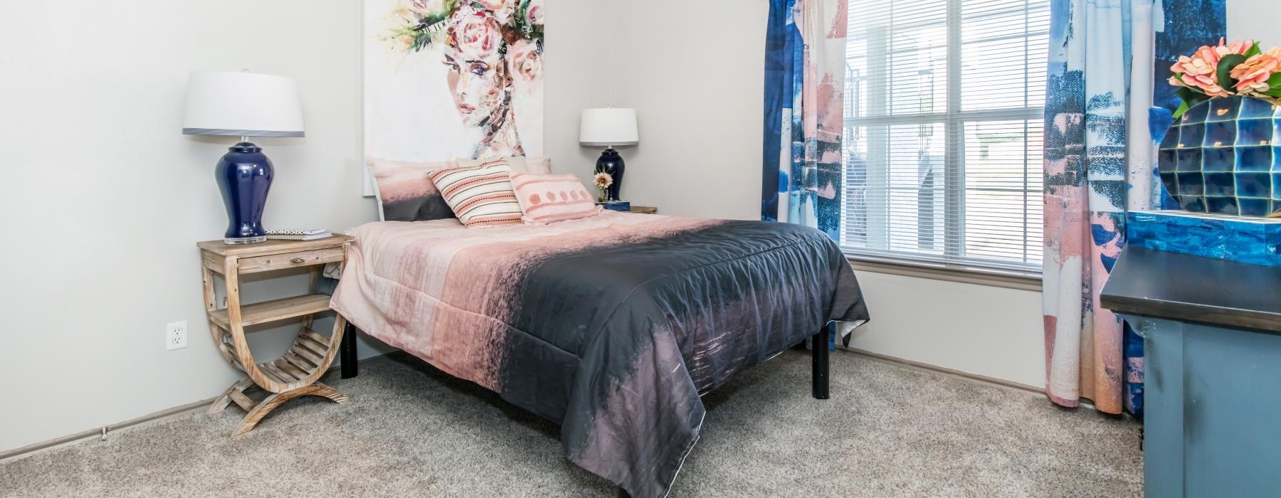 a bedroom with a bed and a fan